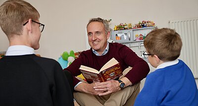 Alex reading to children