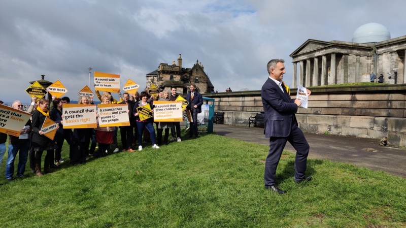 Image of Scottish Liberal Democrat leader Alex Cole-Hamilton MSP with supporters in background