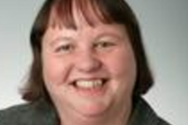 a headshot of Jacquie Bell