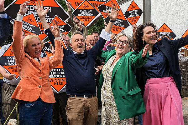 Susan Murray, Alex Cole-Hamilton, Christine Jardine and Wendy Chamberlain celebrating