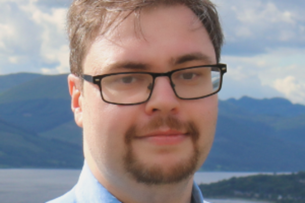 a headshot of Ross Stalker