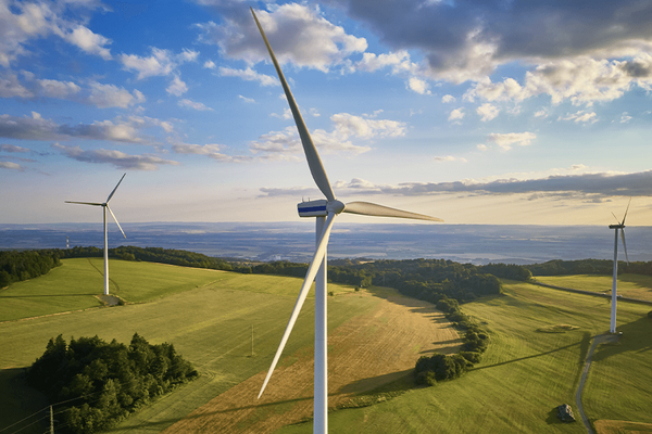 Image of wind turbine surrounded by countryside